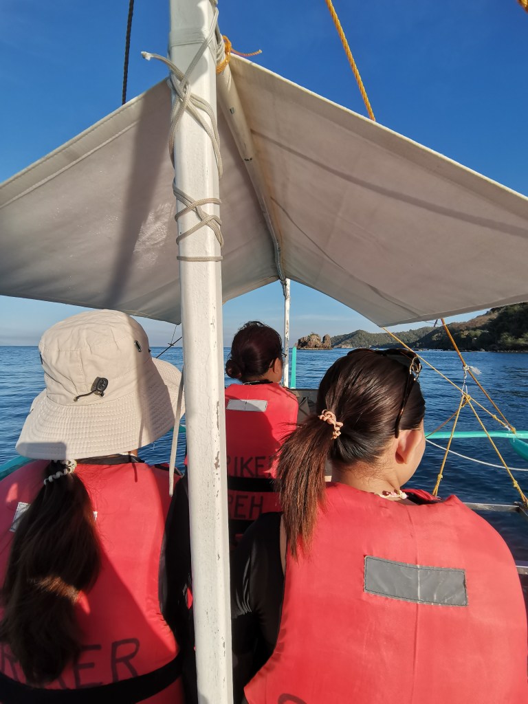 A group of female tourists at boat in Tingloy, Batangas.