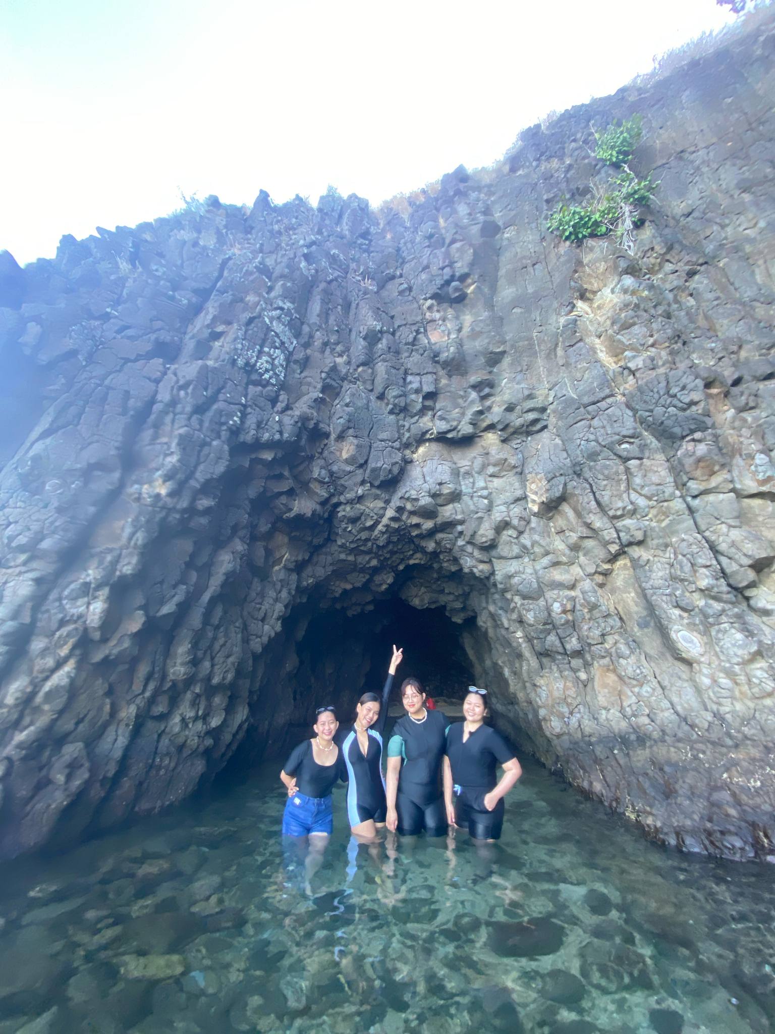 A group of friends in front of Marina Cave in Tingloy, Batangas.